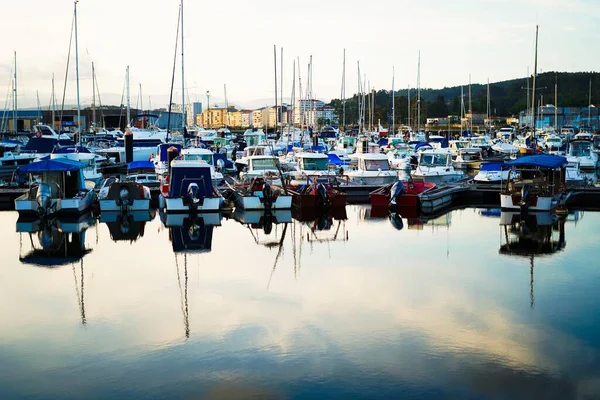 stock image sea port with some boats inside on a blue sunset