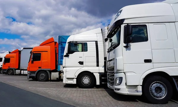 Trucks at parking lot. Delivery cars. Cargo shipping. Lorry. Industry, Freight Truck, Logistics transport Concept.