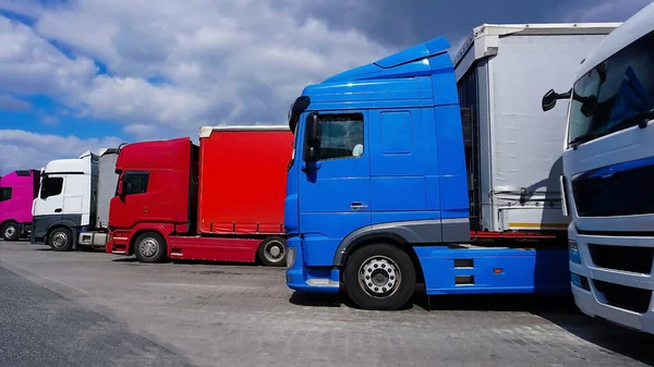 Trucks at parking lot. Delivery cars. Cargo shipping. Lorry. Industry, Freight Truck, Logistics transport Concept.
