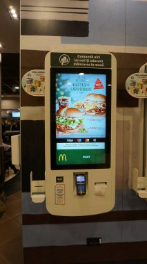 Bucharest, Romania - January 1, 2023: McDonalds Self Serving Machines in McDonalds. It is the world's largest of hamburger fast food restaurants