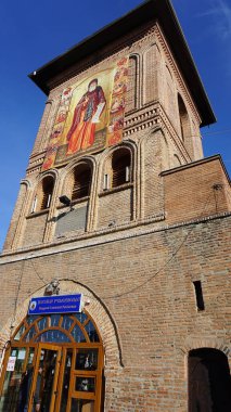 Bucharest, Romania - December 31, 2022: A people near Patriarchal Cathedral of Saints Constantine and Helena and the Palace of the Patriarchate.