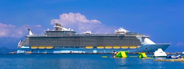 LABADEE, HAITI - MAY 01, 2018: People enjoying sunny day on beach at island Labadee in Haiti on may 1, 2018 clipart