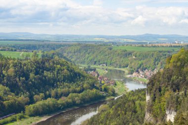 Beautiful summer view of Elbe river from Bastei view pont. Colorful morning scene of Saxon Switzerland national park, Germany, Europe. Splendid landscape of Sandstone Mountains, Saxony. clipart