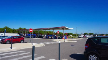 Dresden, Germany - April 18, 2024: View of the Esso gas station. Esso is a trading name for ExxonMobil. American ExxonMobil is the largest company in the world that deals in the sale of oil and gas. clipart