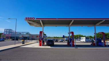 Dresden, Germany - April 18, 2024: View of the Esso gas station. Esso is a trading name for ExxonMobil. American ExxonMobil is the largest company in the world that deals in the sale of oil and gas. clipart