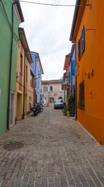 Rimini, Italy - June 25, 2024: Mural on wall at Borgo San Giuliano typical street with low and colorful houses at Rimini, Italy clipart