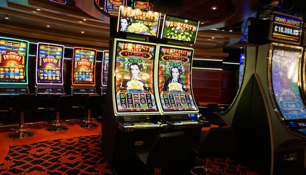 Corfu, Greece - August 9, 2024: View of the casino and gaming tables inside the MSC Fantasia, a cruise ship owned by MSC Cruises.
