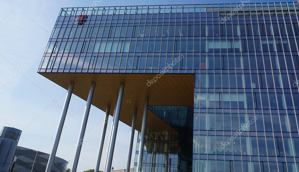 Budapest, Hungary - May 14, 2025: DT-ITS business service centre in Hungary logo on a building with blue sky background. Since its formation in 2006, DT-ITS IT service provider.