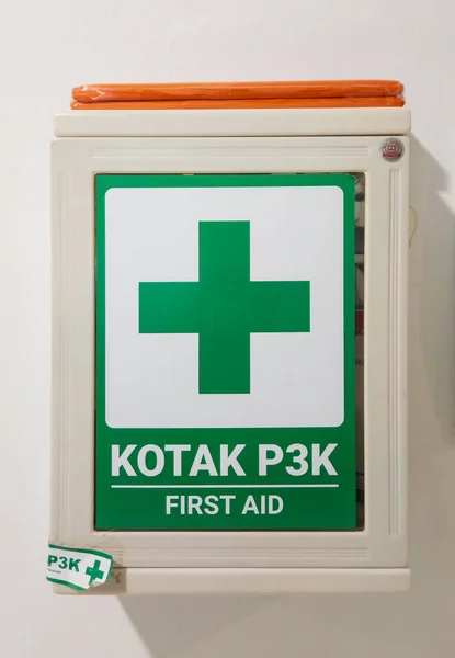 Wall mounted first aid box on white background