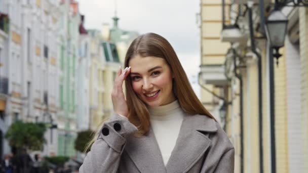 Closeup Young Happy Wearing Casual Gray Coat Woman Straightening Her — Video Stock