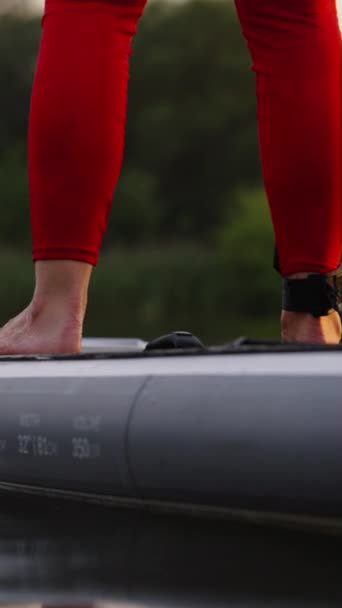 Vertical Screen Legs Woman Wearing Red Leggings Paddling Sup Board — Stock Video