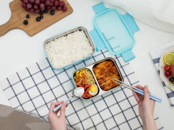 stock image Colored plastic lunchboxes on the table