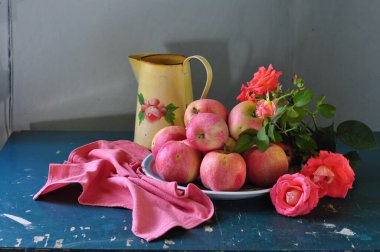 red and white apples on a wooden background. clipart