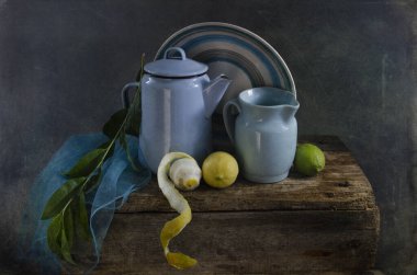still life with a jug of tea and a teapot on a wooden background