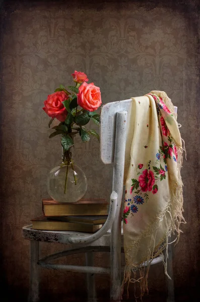 vintage still life with roses and a bouquet of flowers