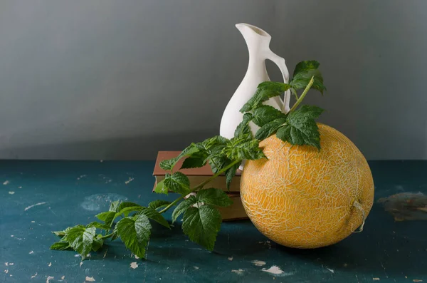 stock image fresh lemons and green leaves on wooden board on orange background. high quality photo 