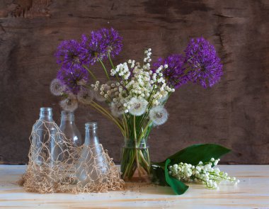 beautiful spring flowers in a glass jar 
