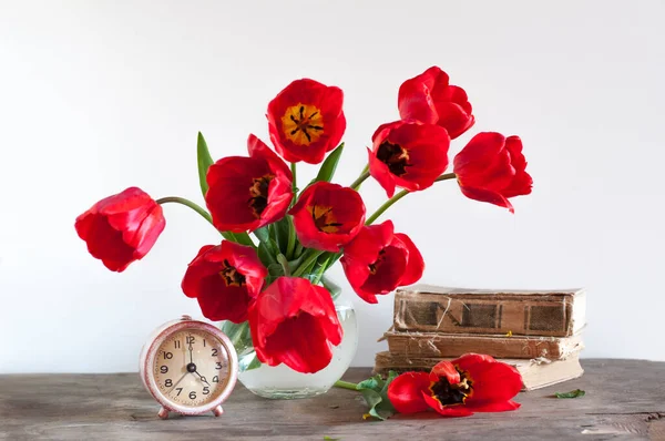 Stock image red tulips in vase 