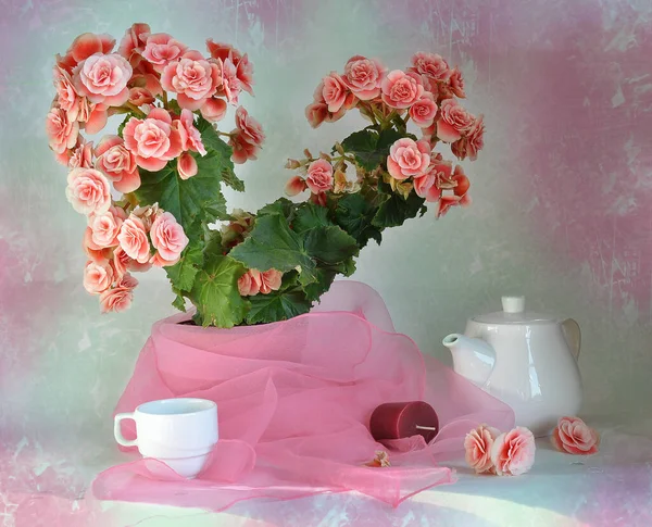 still life with a bouquet of pink roses on a table and a vase of roses. the photo was taken from the window