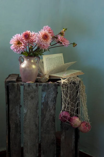 still life with a book and flowers
