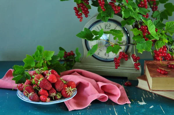 stock image ripe red berries of the garden on a wooden table 