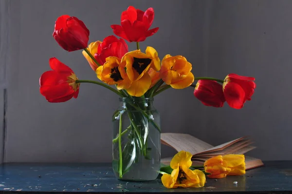 stock image beautiful tulips in vase on dark background, close view 