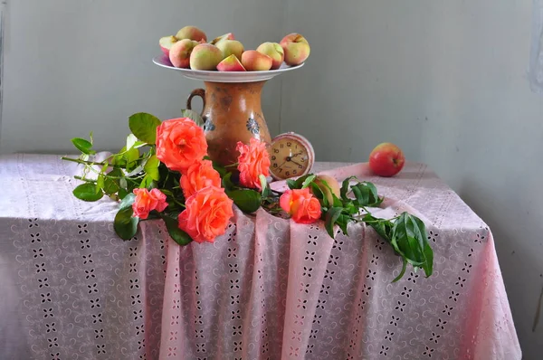 beautiful composition of flowers and fruits on a wooden table