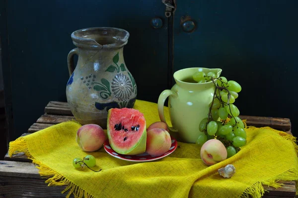 still life with fruit and a cup of tea