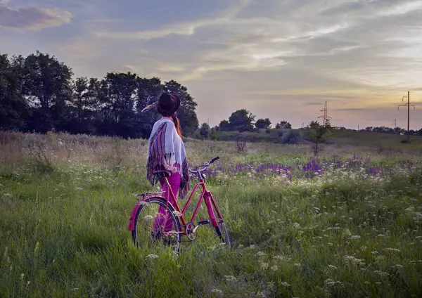 girl riding a bicycle in the countryside