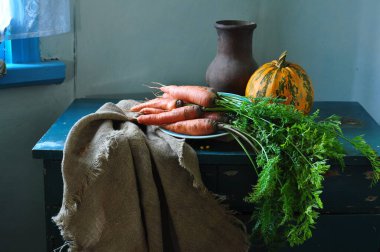 still life with carrots and pumpkin