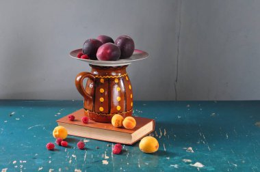 still life with a cup of tea and a jug