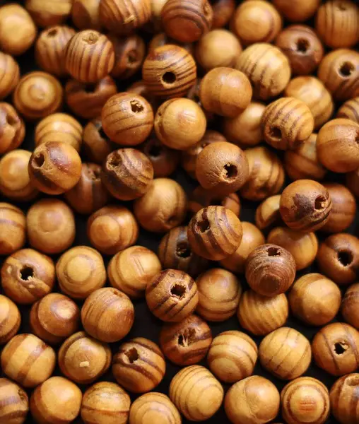 stock image Brown wooden beads, closeup background photo