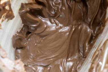 Viyana, Avusturya, 16 Mayıs 2023: çikolata sürüldü ve eritildi. üst görünüm, kapanış ve arkaplan stok resimleri, seçici odak