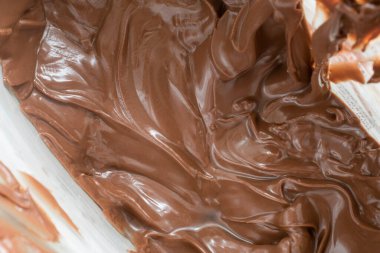 Viyana, Avusturya, 16 Mayıs 2023: çikolata sürüldü ve eritildi. üst görünüm, kapanış ve arkaplan stok resimleri, seçici odak