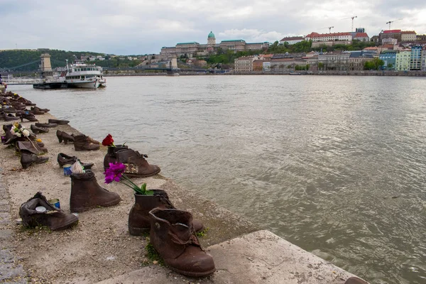 stock image budapest, hungary - april 16, 2023 shoes on the danube Bank, a monument created in memory of the Jews killed during the second world war, between 1944-1945. holocaust memorial, historic sculpture
