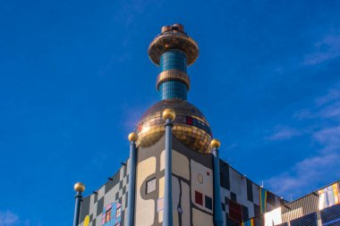 vienna, austria, 15 may 2023 the spittelau waste incineration factory hundertwasser's iconic creation in vienna, blending art, sustainability, and functionality clipart