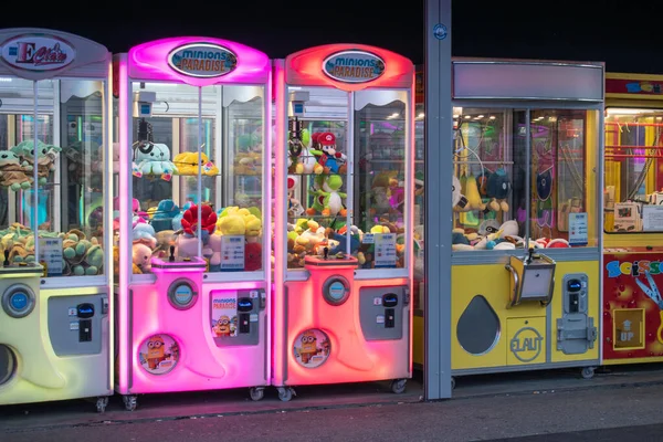 stock image vienna, austria. 25 april 2023 the alluring array of colorful claw machines testing your skills to snag prizes with crane-attached claws in the penny arcade