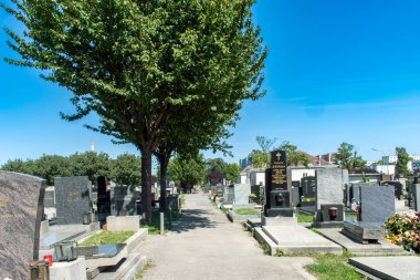 Vienna, Austria. 12 Aug 2023: Simmering Cemetery in Vienna, an ancient burial site dating back to Roman times, features a captivating blend of history, architecture, and solemn beauty. clipart