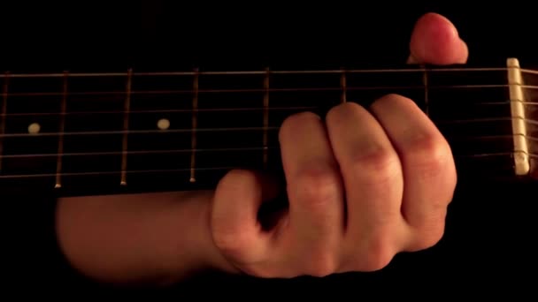 Close Guitar Playing Guitarist Hand Mediator Plays Strings Guitar — Stock Video
