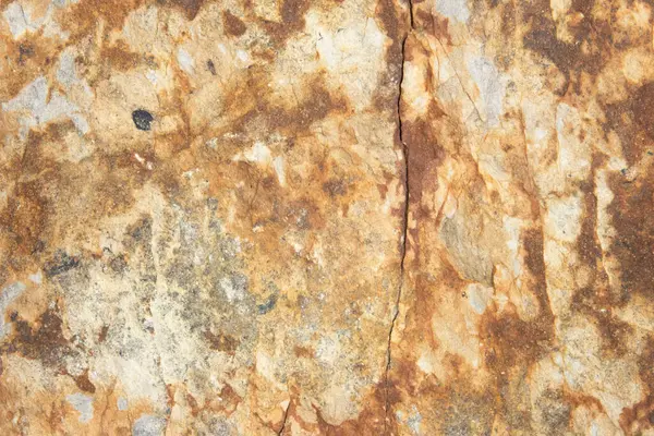 stock image Close up of a white, cream, gray, and reddish brown rust colored rock. Large stone texture background with copy space.