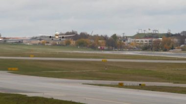 Vilnius, Lithuania - November 03, 2022: Airplane from airBaltic descending at Vilnius Airport.