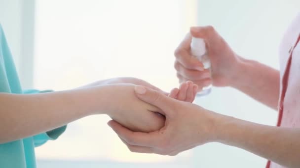Parent Spray Hand His Child Hand Sanitizer Cleaning Hands Hygiene — Stock Video