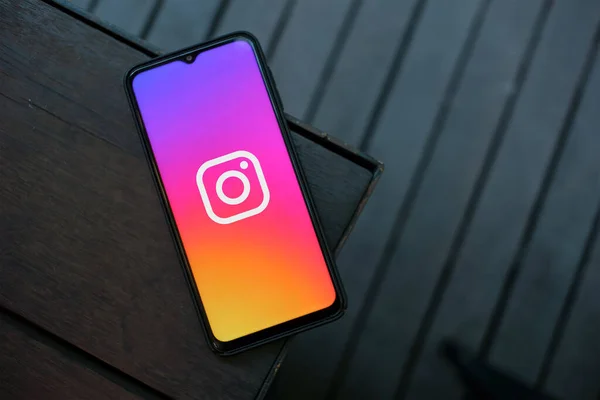 stock image Connecting Devices: Smartphone Showing Instagram Logo on a Table