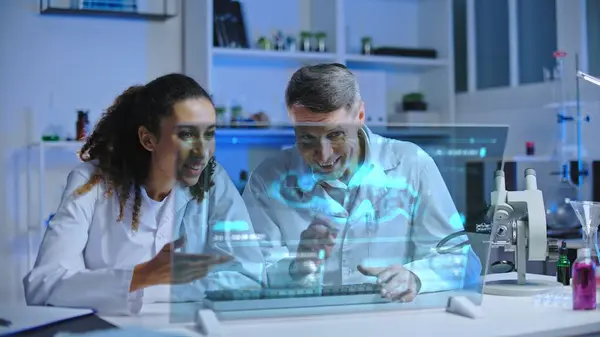 Two scientists satisfied with experiment results, looking at holographic screen