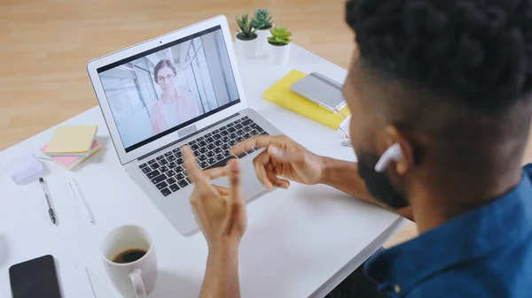African American man having video call with girlfriend, distance communication