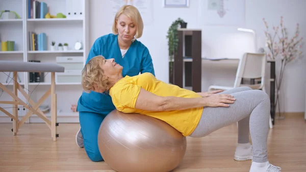 Rehabilitation Doctor Helps Patient Train Her Back Fitball Physical Medicine Stock Picture
