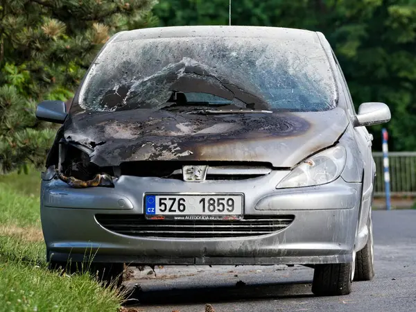 stock image Burnt and charred car after fire car accident. Safety driving concept.