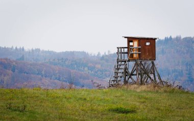 High seat for hunters and gamekeepers in the nature. Nature of Czech republic. clipart