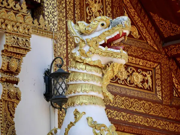 The lion statue decorated at the base of Sinhalese style pagoda that contain Buddha relics located at the Wat Phra Singh temple. One of Chiang Rais oldest temples was built in 1385
