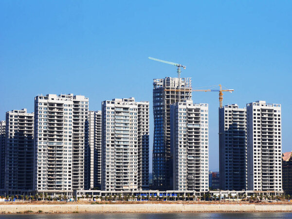 construction site with crane, Tower Crane Operating At Development Site, City, crane and construction with apartment buildings, property development, infrastructure, Urban landscape, civil engineering